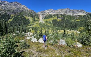 woman hiker showing backpacking tips